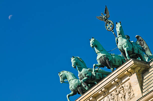 istock Berlin Brandenburg Gate Quadriga blue moon 173866876