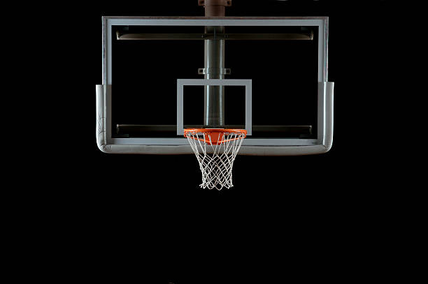 Basketball Backboard and Hoop A glass basketball backboard and hoop isolated on black; lighting from the left and right sides.Here is a good link to some other basketball hoop stock pictures, royalty-free photos & images