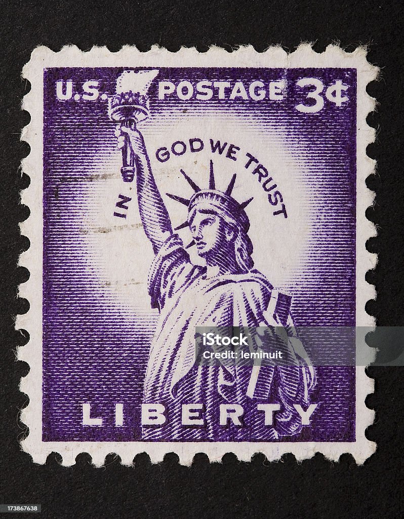 Statue of liberty stamp with clipping path A United States postage stamp with the statue of liberty, isolated on black background.  Clipping path is included, you can clip it and paste it in your own postal compositions!. American Culture Stock Photo