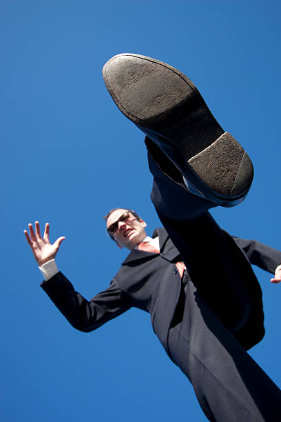 istock Business Stomping on the Little Guy 173867942