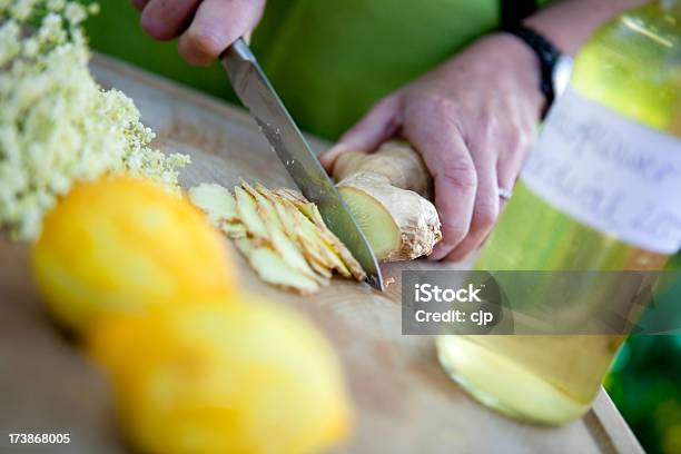 Making Ginger And Elderflower Cordial Stock Photo - Download Image Now - Bottle, Chopping Food, Cooking