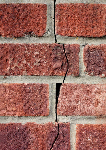 istock Survey - crack in brick wall of house 173868143