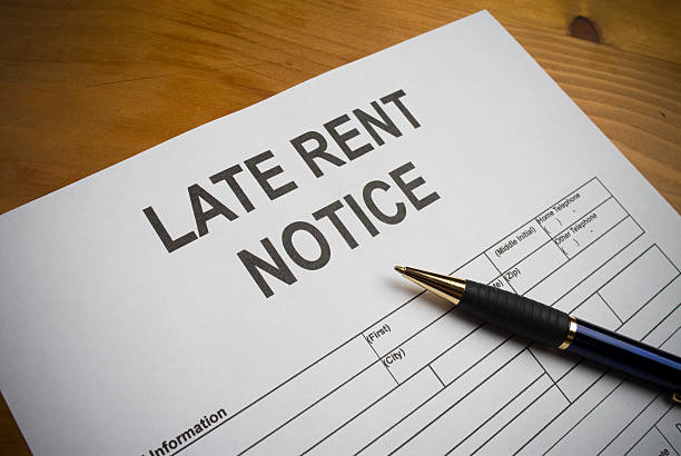 Late rent notice paperwork with pen stock photo