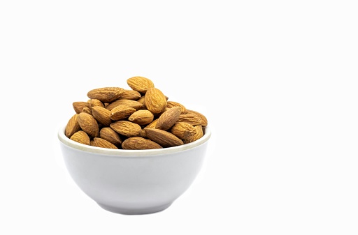 Almond Nut White Bowl Isolated on White Background in Horizontal Orientation with Copy Space, Healthy Eating and Lifestyle Food Concepts.