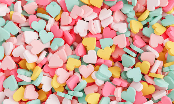 heart shaped pills background colorful background of many stacked heart shaped pills. 3d rendering candy stock pictures, royalty-free photos & images