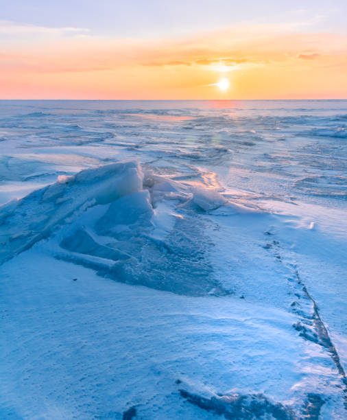istock Snowdrifts on the ice surface during sunset. 1738696050