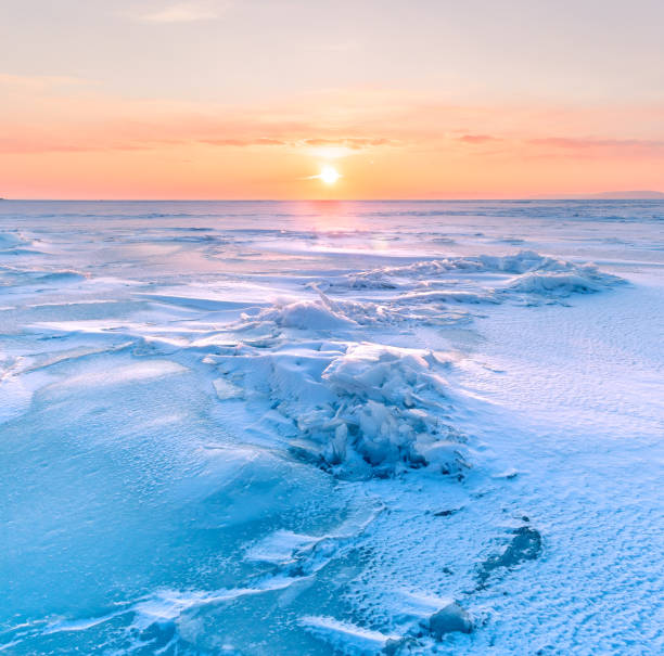 istock Snowdrifts on the ice surface during sunset. 1738696055
