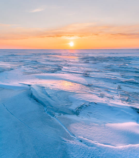 istock Snowdrifts on the ice surface during sunset. 1738696516