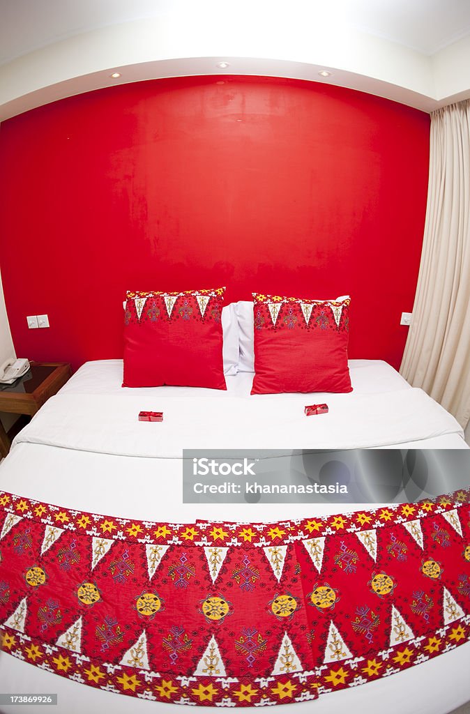 bedroom decorated in indonesian style bed in a hotel room Bed - Furniture Stock Photo