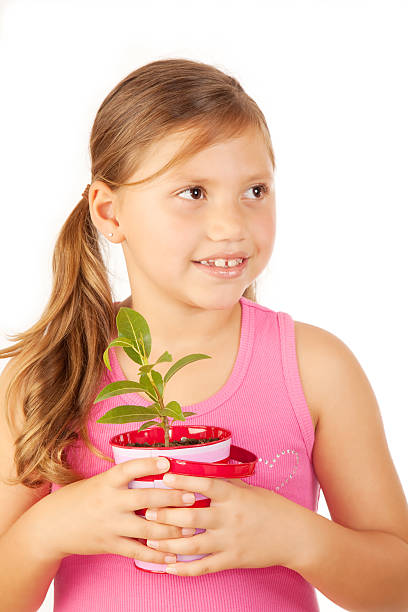 istock Girl Holding A Plant 173870139