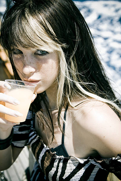 istock young woman having a drink 173870574