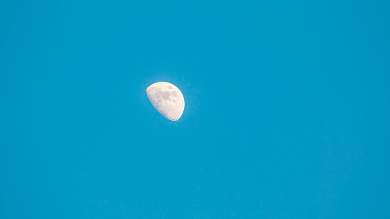 image of white moon in blue sky