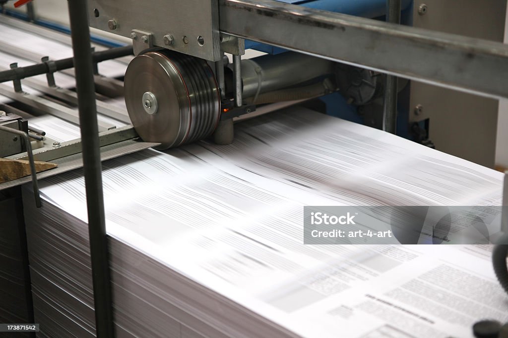 Print shop machine Print shop machine - Folding Blurred Motion Stock Photo