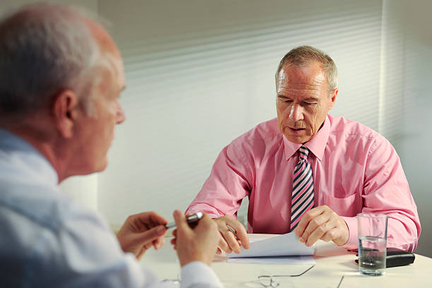 istock senior business men in meeting 173871548