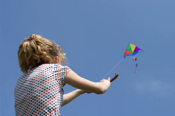 istock young girl flying a colorful kite 173872167