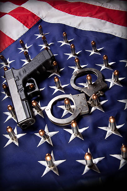 istock Pistol, handcuffs, bullets and flag (vertical) 173872174