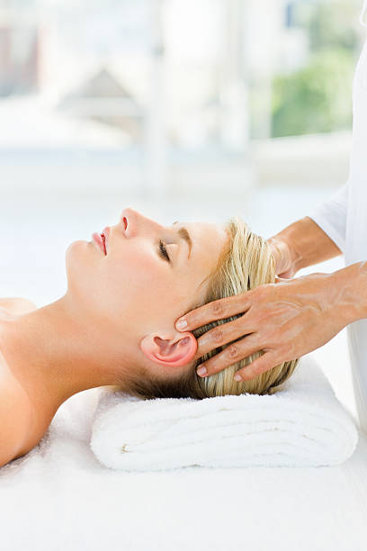 istock Young woman having  head massage at spa 173872191