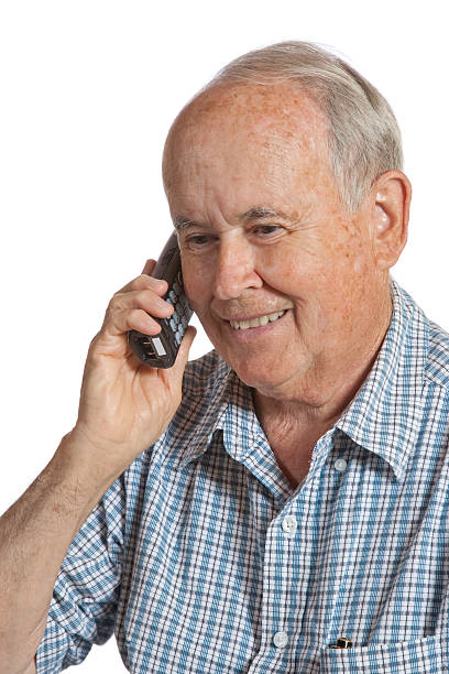 Senior Citizen on the Phone Elderly Male talking on a cordless telephone comb over stock pictures, royalty-free photos & images