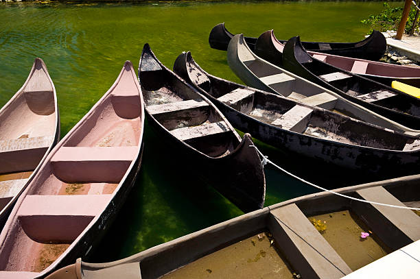 istock Canoes in Group on Tropical Clear Lake 173873351
