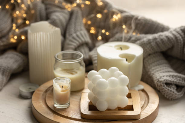 istock A cozy composition with candles, a knitted element and a garland. 1738734037