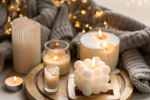 istock A cozy composition with candles, a knitted element and a garland. 1738734039
