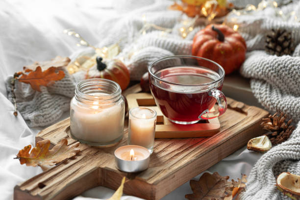 istock Autumn composition with a cup of tea, leaves and a knitted element. 1738734040
