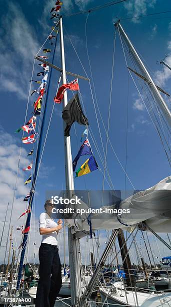 Luxury Yacht Preparing To Sail Stock Photo - Download Image Now - Adult, Beautiful People, Beautiful Woman