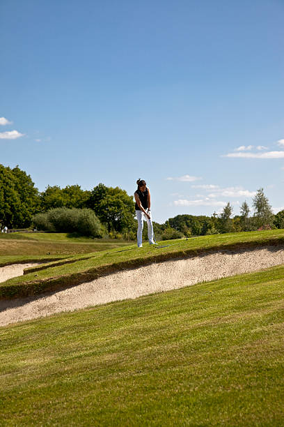 istock young female golf professional 173874958