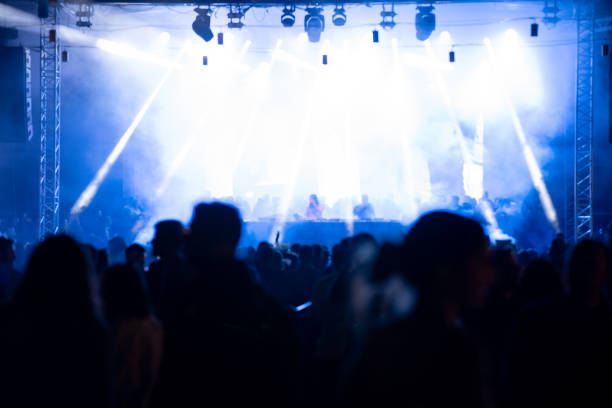 istock Crowd people and stage lights at the party blurred. 1738751855