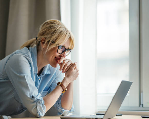 istock A Happy Beautiful Blonde Businesswoman Working On Her Computer 1738753103