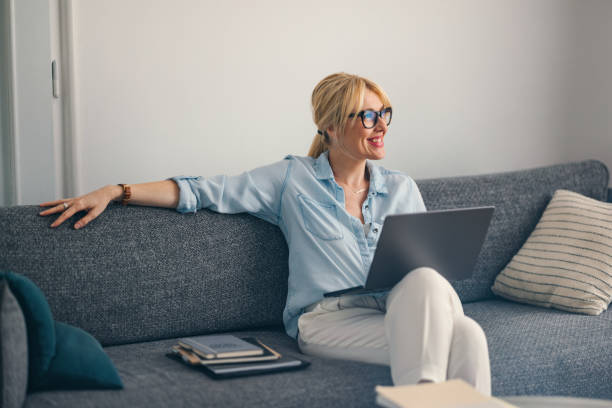 istock A Happy Beautiful Blonde Businesswoman Looking Away While Working From Home On Her Computer 1738753189