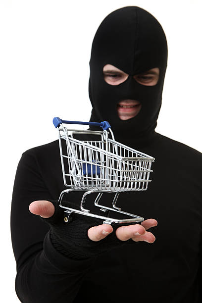 istock Criminal or Thief on White Holding Trolley 173875350
