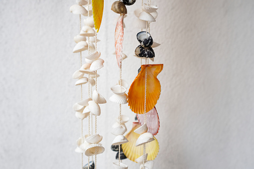 Pictures of shimmering seashells hang on the front door and make soft, soothing music when the wind blows.