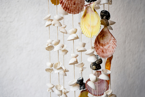Pictures of shimmering seashells hang on the front door and make soft, soothing music when the wind blows.