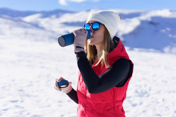 istock Young woman drinking water from bottle in highlands 1738762207