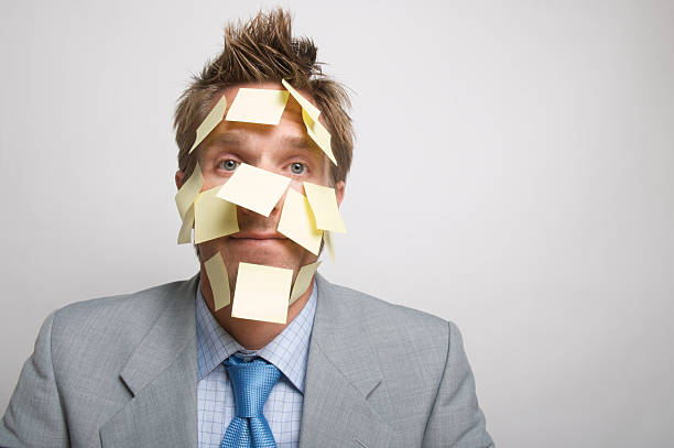 istock Businessman Office Worker Yellow Sticky Reminder Mess White Wall 173876625