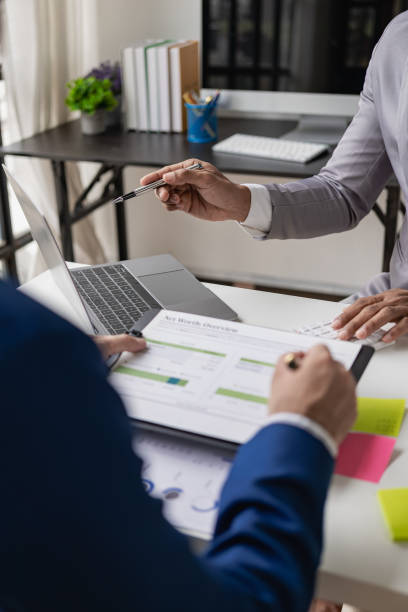 istock Vertical images, charts and income graphs using a laptop computer. Business analysis and strategy concepts Meet with a business advisor and discuss finances, close-up photo 1738775911