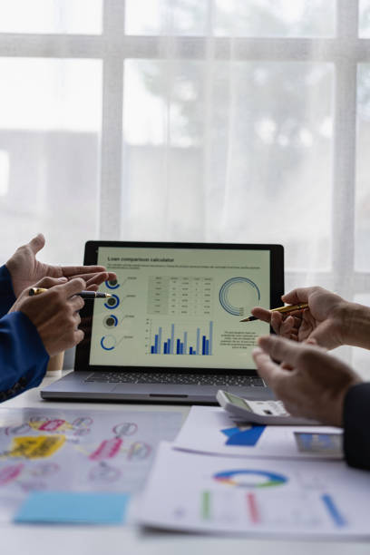 istock Vertical images, charts and income graphs using a laptop computer. Business analysis and strategy concepts Meet with a business advisor and discuss finances, close-up photo 1738775914