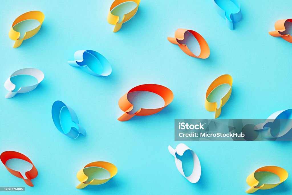 Colorful Speech Bubbles On Blue Background Colorful speech bubbles on blue background. Horizontal composition. Abstract Stock Photo