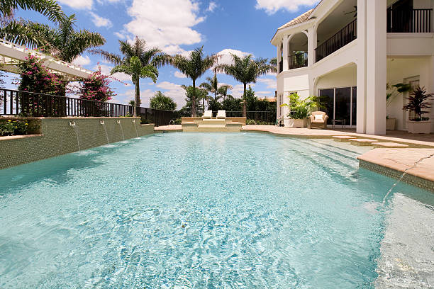 istock Beautiful custom backyard luxury pool water cool mansion home palm 173877638