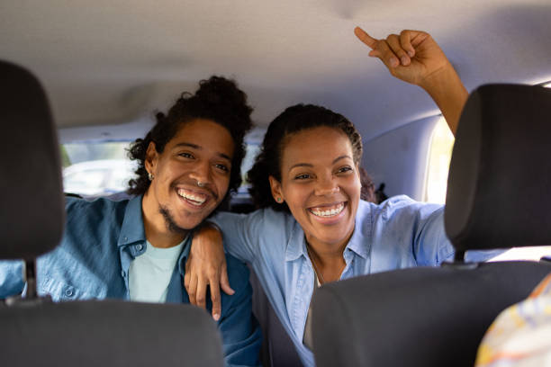 istock Happy African American friends sharing a car while going on a trip. 1738776508