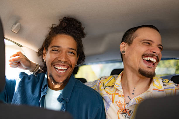 istock Young cheerful men having fun in a taxi. 1738778499