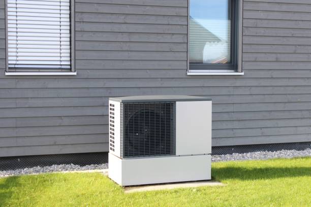 istock Modern detached house with a heat pump in the front garden. A climate-friendly method of heating. 1738789750
