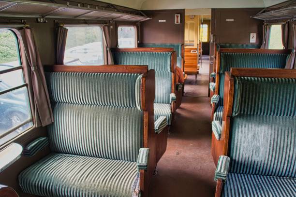 istock Interior view of a vacant train car, with empty seats and a window in full view 1738796041