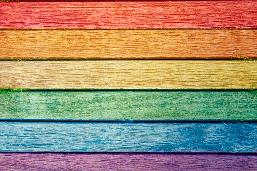 Pride flag with wooden background