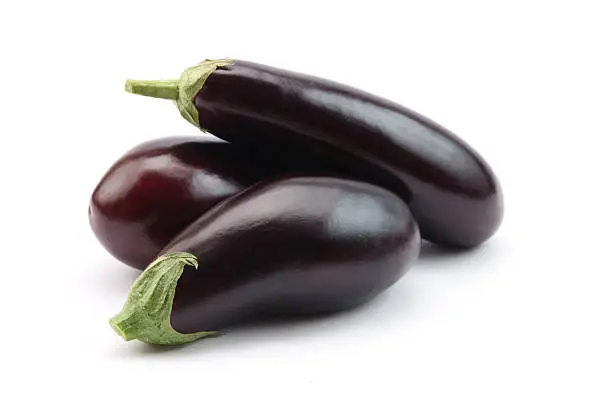 Three eggplants isolated on white. Italian variety.