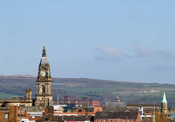 Skyline of Bolton, Lancashire  "Skyline of Bolton, Lancashire with the prominent town hall clock and the moors beyond." lancashire photos stock pictures, royalty-free photos & images