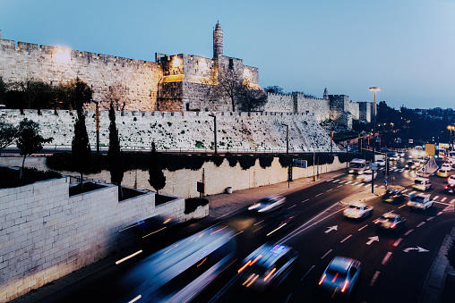 Long exposure of traffic near the old city in Jerusalem, Israel with the Tower of David visible