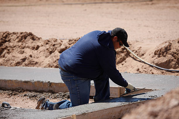 istock Man Smoothing Cement on Job Site 173880764