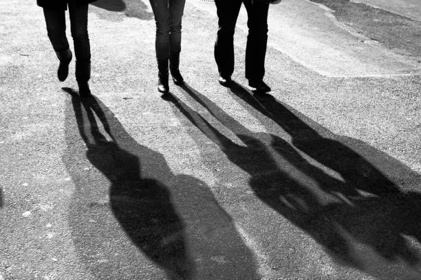 istock Three men walking Downtown New York City shadows 173881119